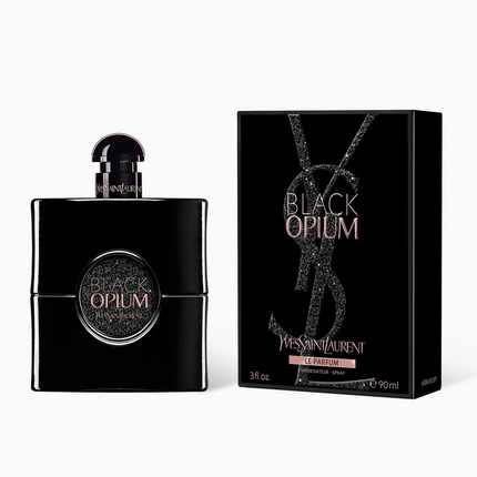 Black Opum Eau de Parfum bottle and its packaging box by Yves Saint Laurent, both in black with gold lettering, on a clean white background.
